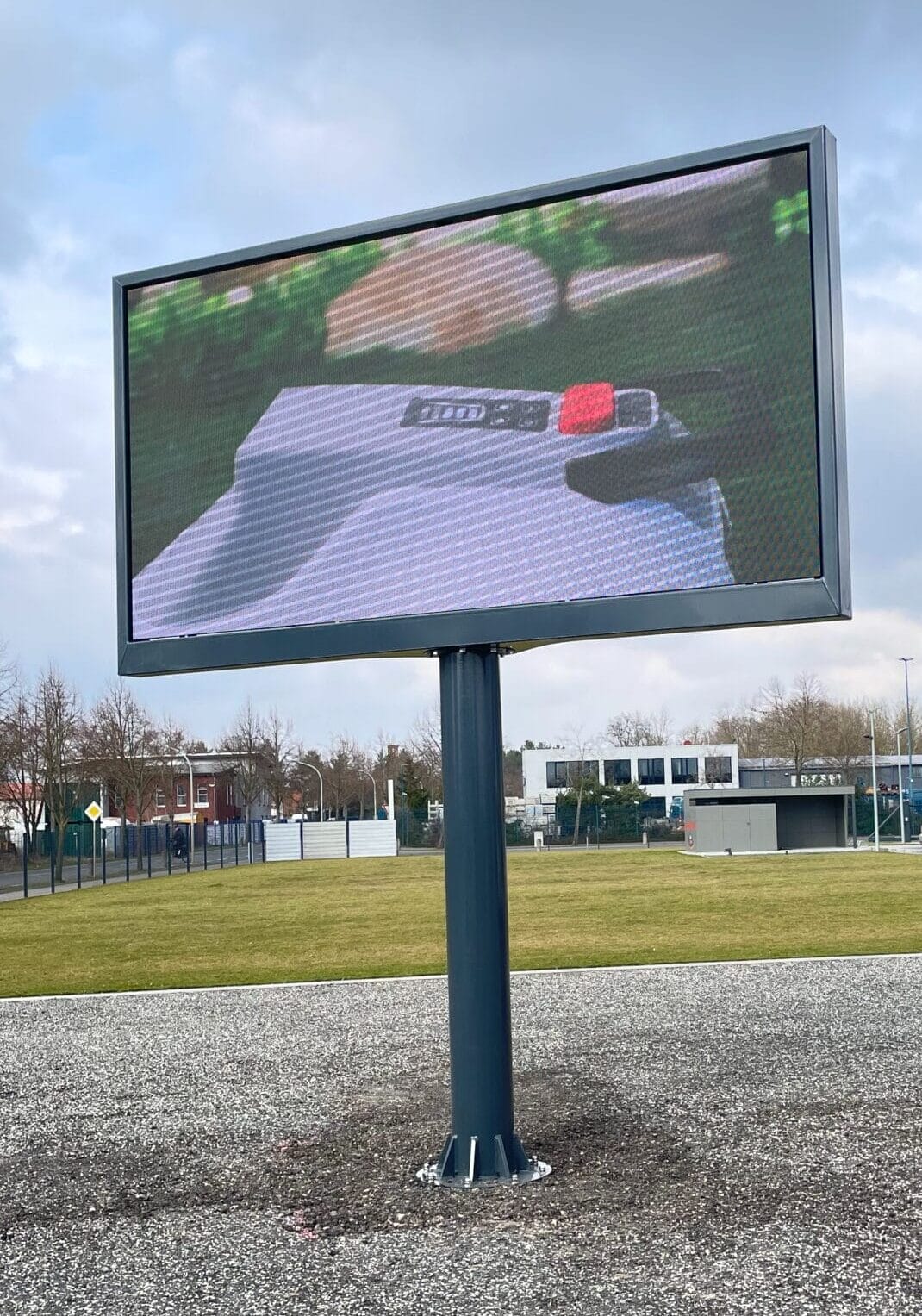 a large screen on a pole